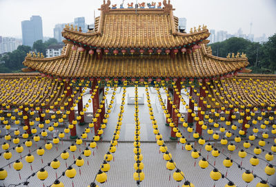 Yellow lanterns hanging at temple