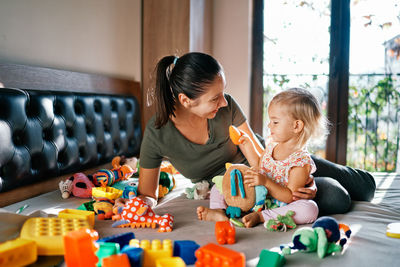 Family playing with toys at home