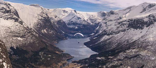 Scenic view of snowcapped mountains against sky