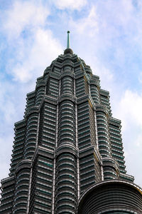 Low angle view of skyscraper against sky