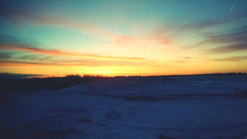 Scenic view of landscape against sky during sunset