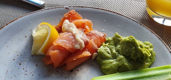 High angle view of fish in plate on table