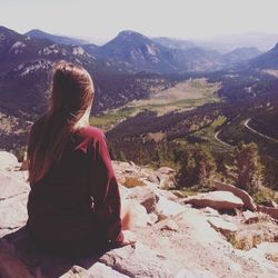 Woman sitting on landscape