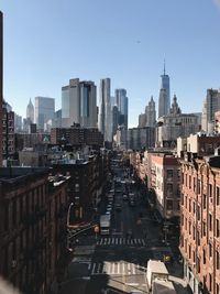 Road amidst buildings in city