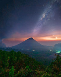 Scenic view of landscape against sky at night