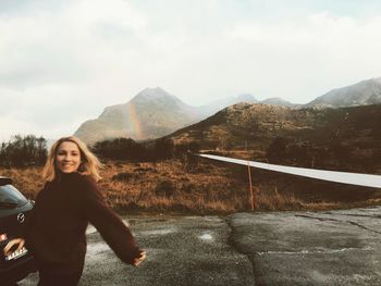 Portrait of woman against mountains