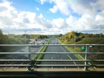 High angle view of road against cloudy sky