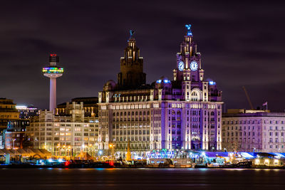 Illuminated buildings in city at night