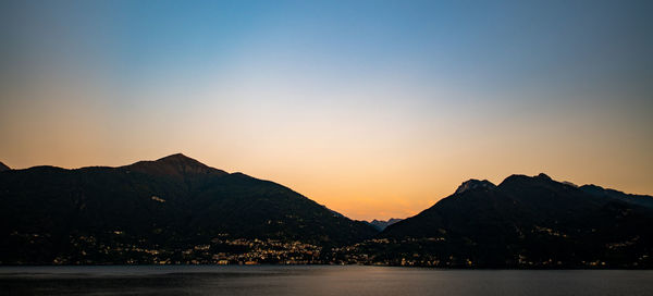 Scenic view of silhouette mountains against sky during sunset