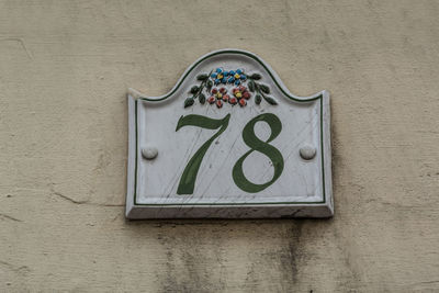 Detail shot of number 78 on wall