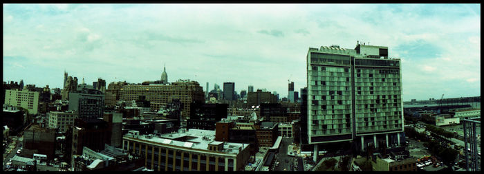 High angle view of buildings in city against sky