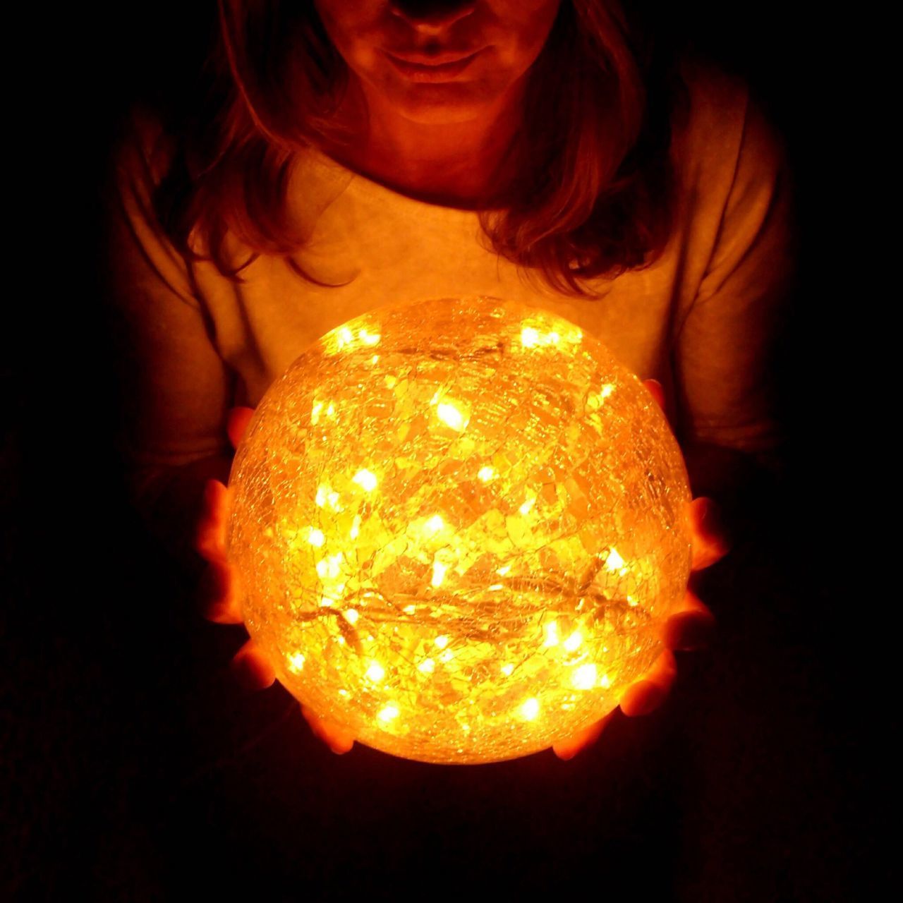 CLOSE-UP OF ILLUMINATED YOUNG WOMAN WITH RED LIGHT