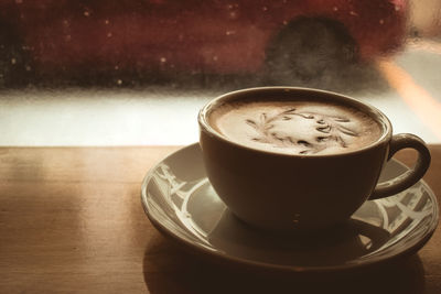 Close-up of coffee cup on table