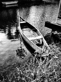 Boats moored in river