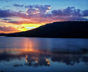 Scenic view of lake against sky during sunset