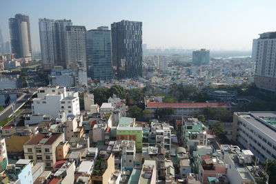 High angle view of buildings in city against clear sky