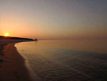 Scenic view of sea against clear sky during sunset