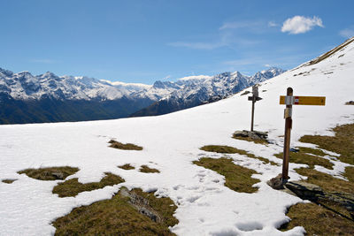 Scenic view of snow covered mountains against sky