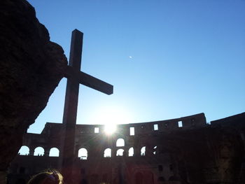 Low angle view of built structure against clear blue sky