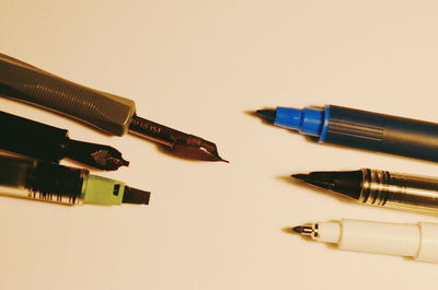 Close-up of pencils against white background