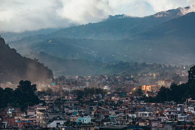 Aerial view of townscape and mountains 