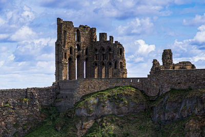 Old ruin building against cloudy sky