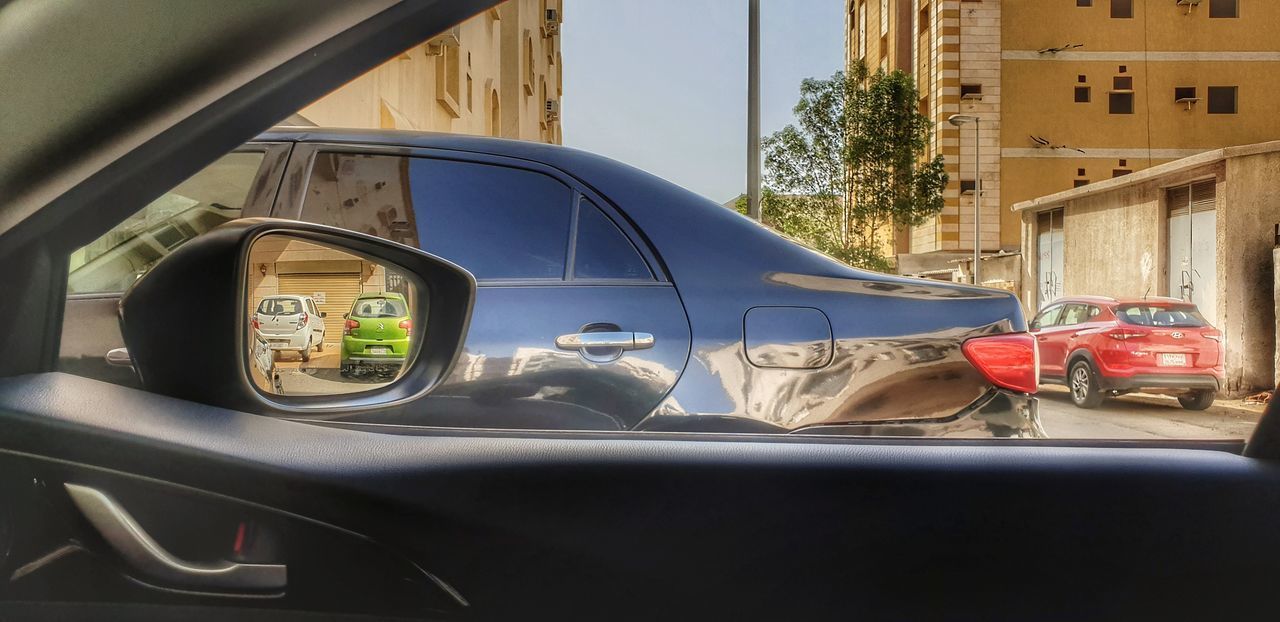 REFLECTION OF CAR ON WINDOW