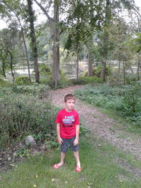 Portrait of boy standing on land