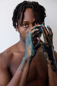 Artistic black man with painted hands