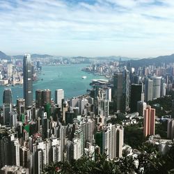 High angle view of modern buildings in city against sky