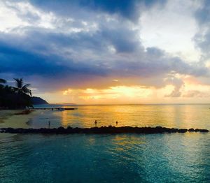 Scenic view of sea against cloudy sky