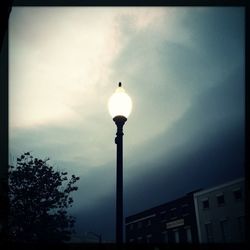 Low angle view of building against cloudy sky