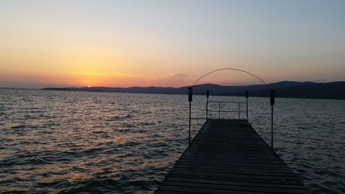 Scenic view of sea against clear sky during sunset