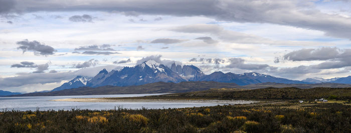 Scenic view of mountains against cloudy sky