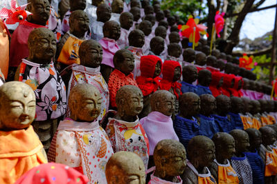 Close-up of statues for sale in market