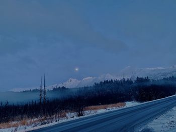 Scenic view of snowcapped mountains against sky during winter