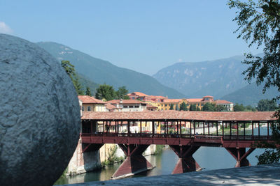 View of bridge over mountain against clear sky