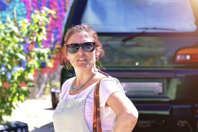 Portrait of young woman in car