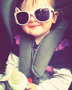 Portrait of smiling girl wearing sunglasses