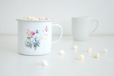 Close-up of coffee served on table against white background