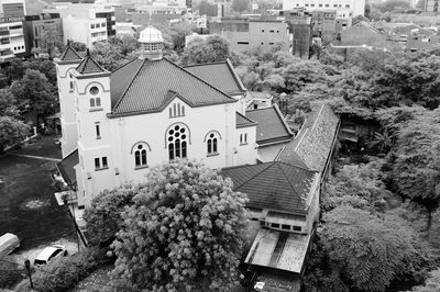 Exterior of houses in town against sky