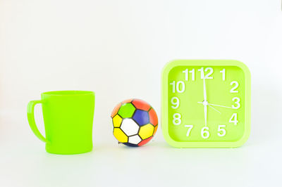 Close-up of green objects against white background