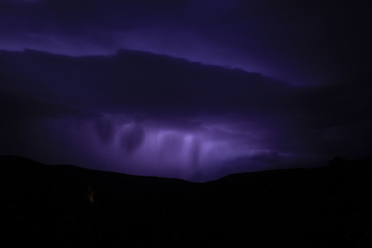 night, beauty in nature, sky, mountain, scenics - nature, cloud, environment, power in nature, darkness, dramatic sky, storm, no people, nature, lightning, silhouette, thunderstorm, star, landscape, dark, purple, mountain range, awe, astronomy, thunder, space, outdoors, tranquility