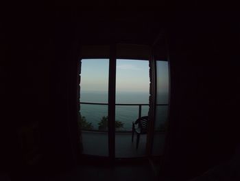 View of sea through window