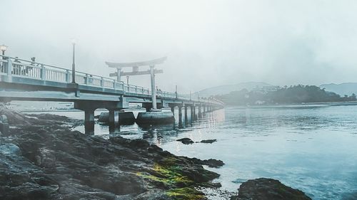 Bridge over bay against sky