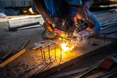 Welder at work in factory