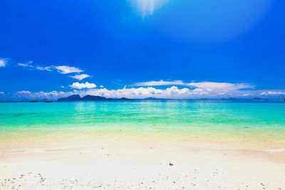 Scenic view of sea against blue sky