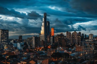 Illuminated cityscape against sky