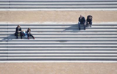 People sitting on staircase