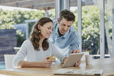 Couple doing online payment with credit card